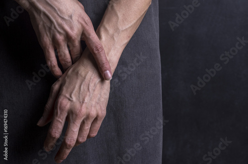 Womans hands with blood veins. Emotional gesture.