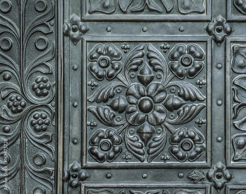 Decorative element of the old iron door.