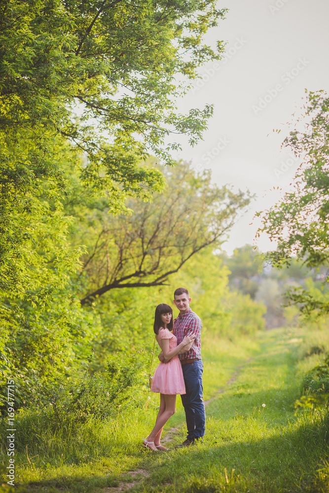 young couple in love together on nature young couple in love together on nature
