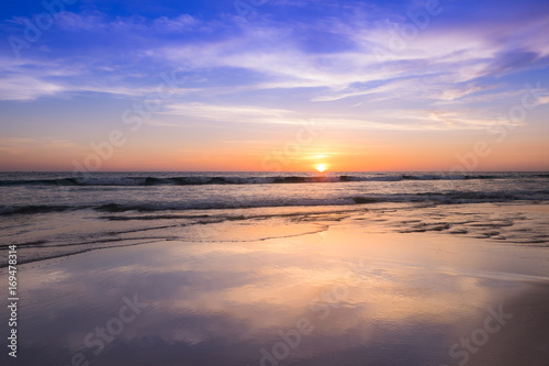 Sunset at the beach with light golden time and the sky reflection with surface ,background,noised and gain