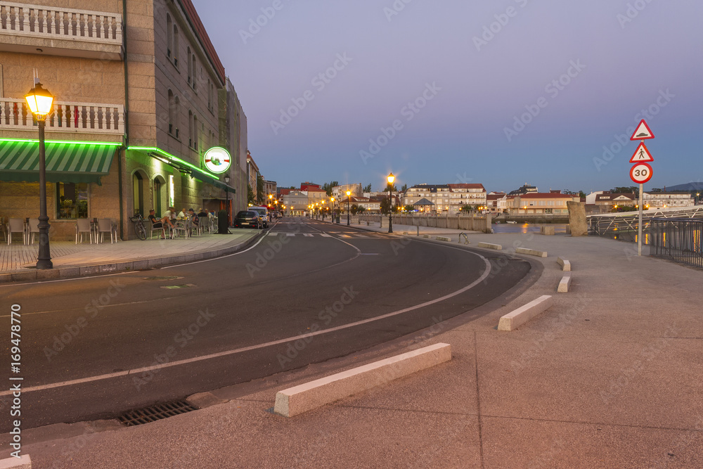 Boardwalk and street at night