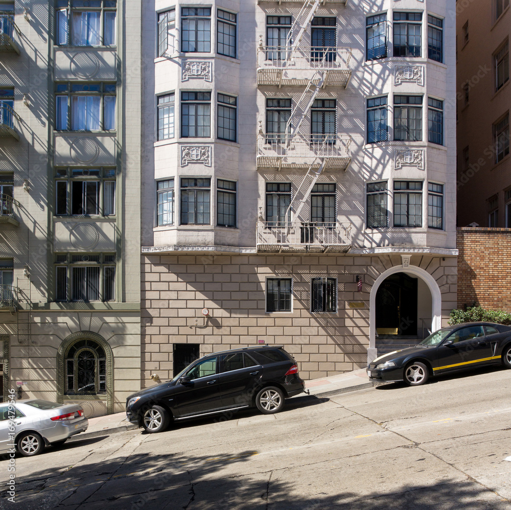Facade of residential buildings in San Francisco California USA. Angle of the roadpath on the streets of San Francisco