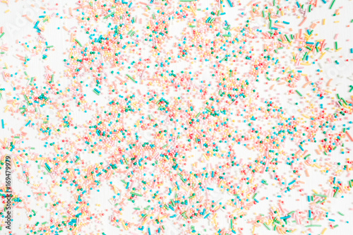 Colorful confetti pattern on white background. Celebration concept background. Flat lay, top view.