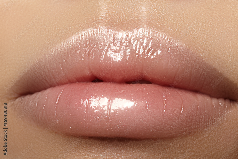 Fototapeta premium Closeup plump Lips. Lip Care, Augmentation, Fillers. Macro photo with Face detail. Natural shape with perfect contour