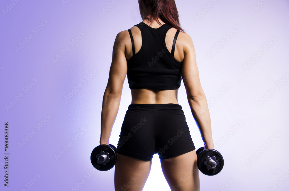 Fototapeta premium Back view woman bodybuilder 