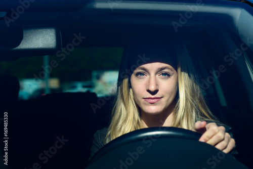 Fényképezés Young woman driving a car
