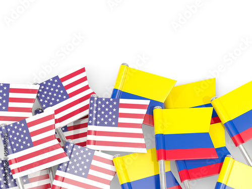 Flag pins of USA and Colombia isolated on white. 3D illustration © Mikhail Mishchenko