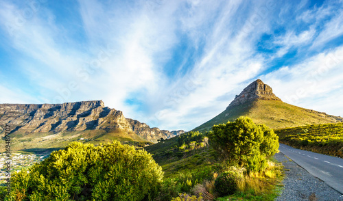 Sun setting over Table Mountain  Lions Head and the Twelve Apostles. Viewed from the road to Signal Hill at Cape Town  South Africa