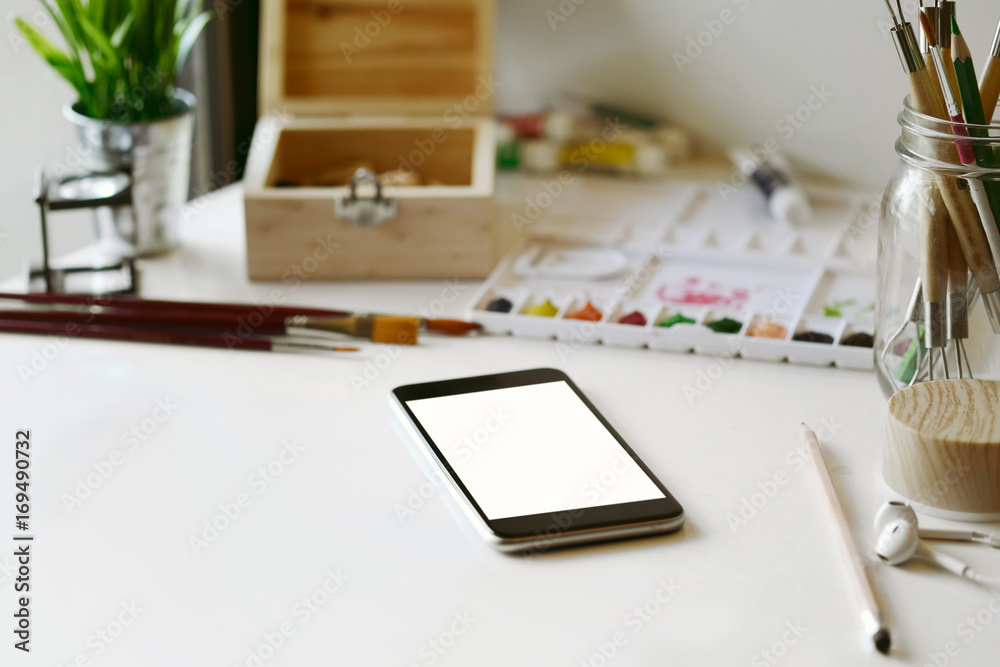 Artist workplace : White table of an artist with art tools for drawing. Artist workplace : White table of an artist with art tools for drawing.