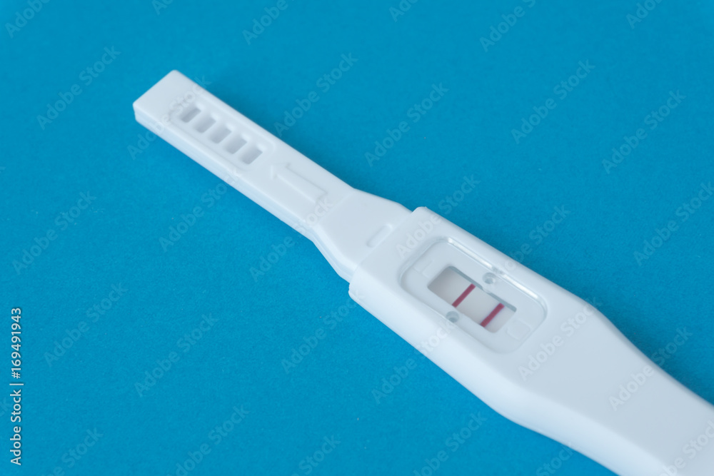 Pregnancy test with light blue background, health care concept Pregnancy test with light blue background, health care concept
