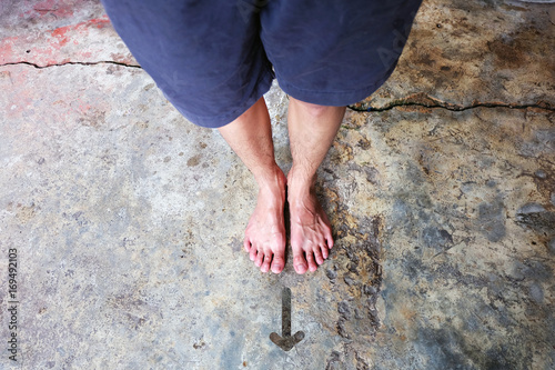 Drawn Direction Arrow, Male Barefeet on the Concrete Background Great For Any Use.