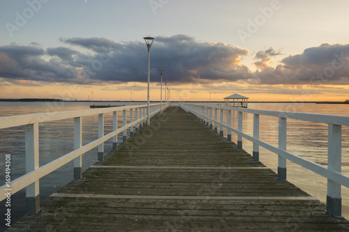 Sunset on the lake  wooden  white pier