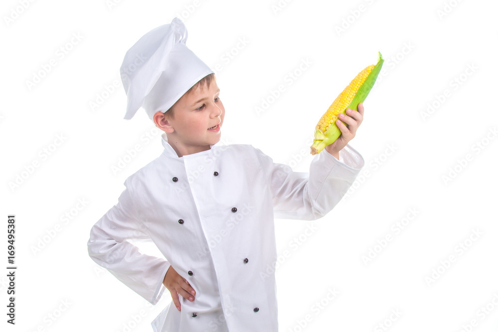 Small chef is looking at bright yellow fresh corn, isolated on white background Small chef is looking at bright yellow fresh corn, isolated on white background