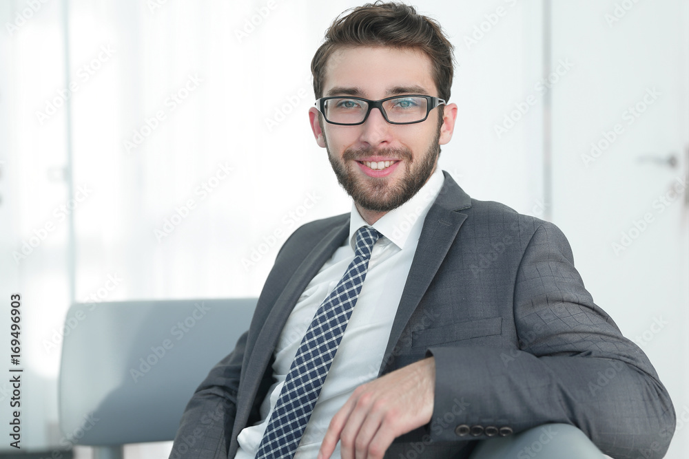 closeup.confident businessman sitting in a chair closeup.confident businessman sitting in a chair