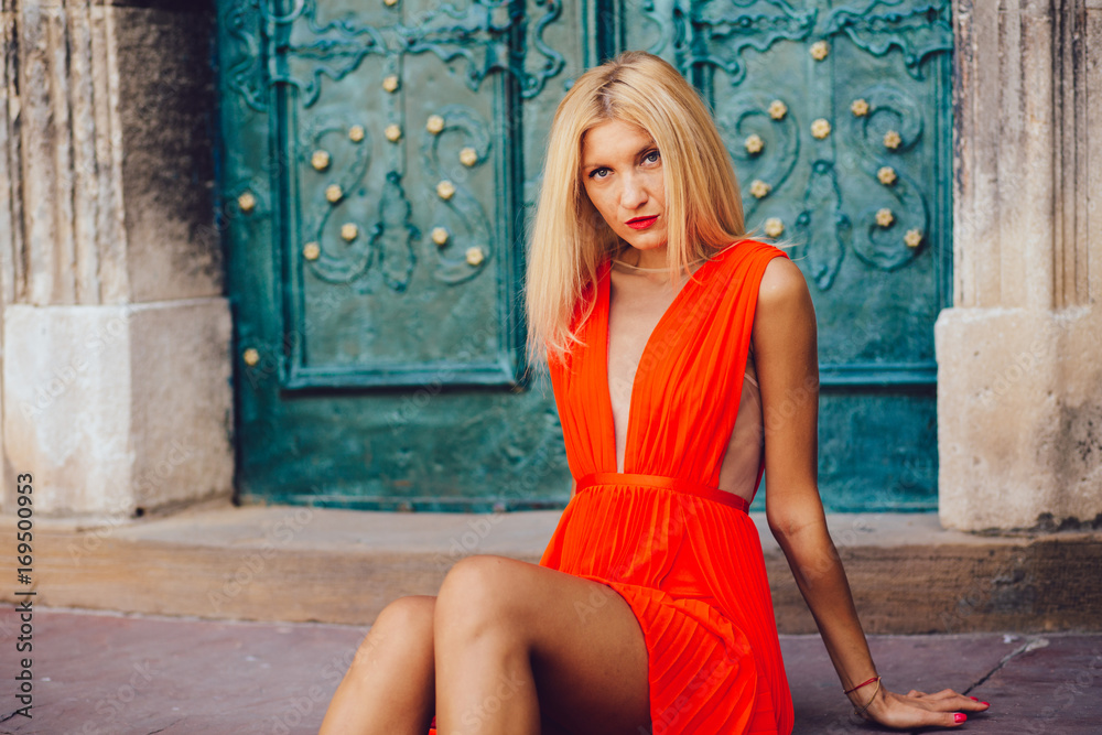 Orange dressed blonde