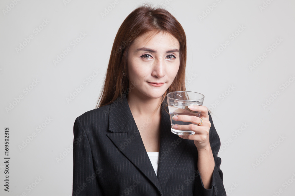 Young Asian woman with a glass of drinking water. Young Asian woman with a glass of drinking water.