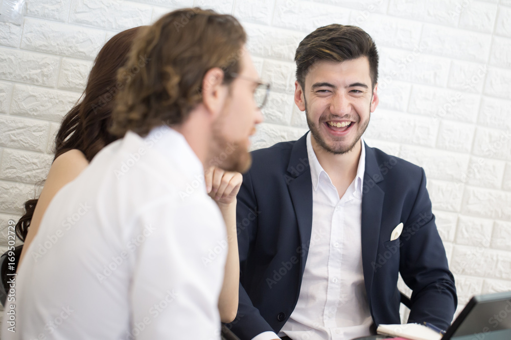Businesspeople Sitting in office and Work Together with Smiling. Businessman have a Meeting with Team. Businesspeople Working concept. Businesspeople Sitting in office and Work Together with Smiling. Businessman have a Meeting with Team. Businesspeople Working concept.