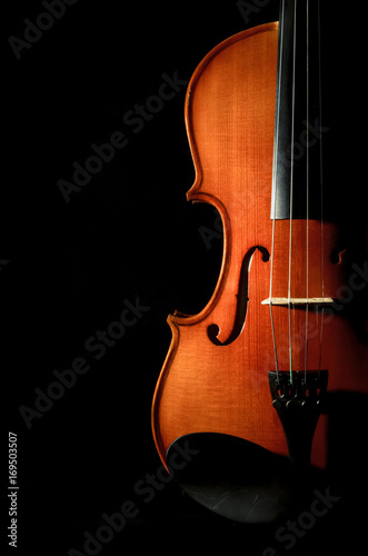 Obraz na płótnie Closeup Violin orchestra musical instruments on black background w salonie