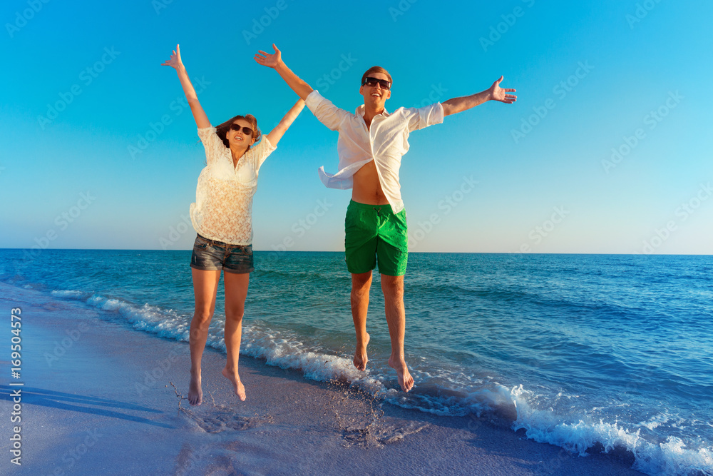 Happy young couple enjoying the sea Happy young couple enjoying the sea