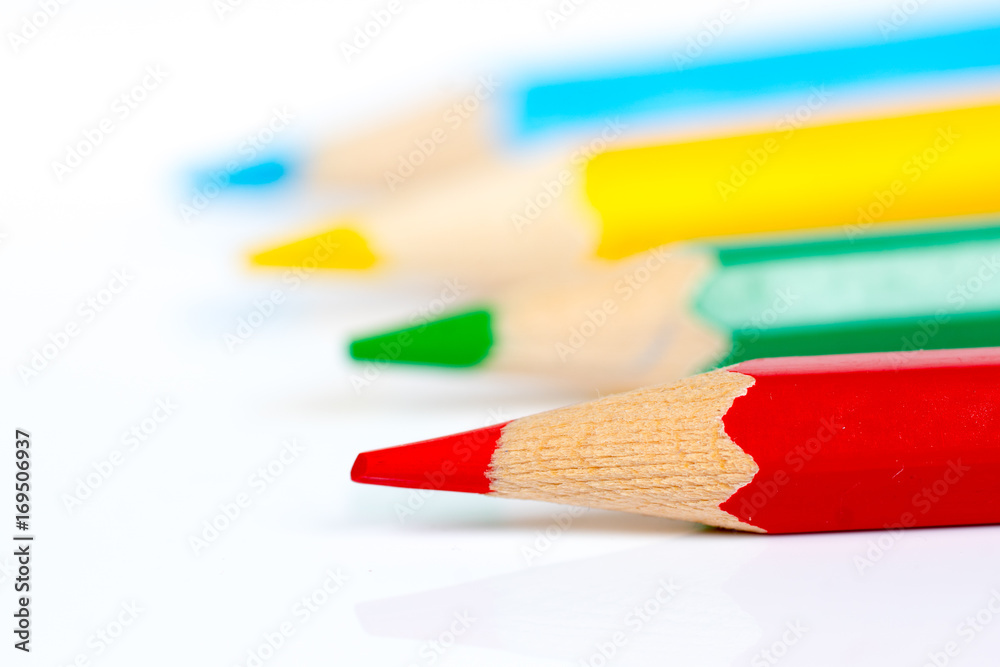 four colorful pencils over white background, creative skills development concept four colorful pencils over white background, creative skills development concept
