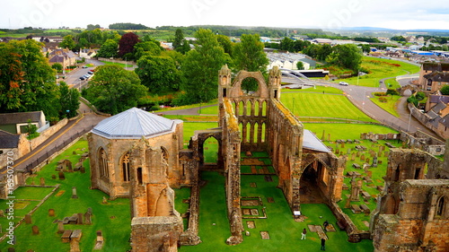 Elgin - UK - August 28 - 2017: Tourists visiting the medieval ruins of The Holy Trinity Cathedral, on a rainy day.