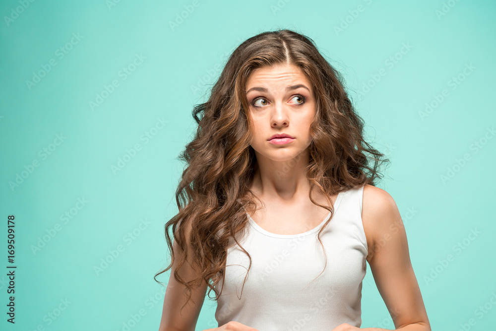 Portrait of young woman with shocked facial expression Portrait of young woman with shocked facial expression