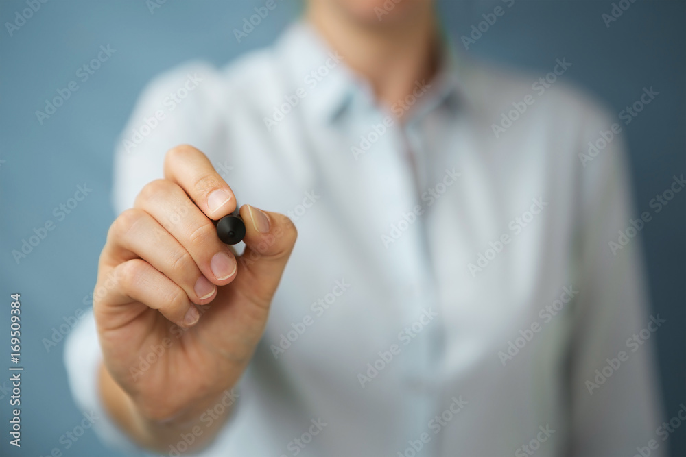 Businesswoman writing with a pen on a digital screen Businesswoman writing with a pen on a digital screen