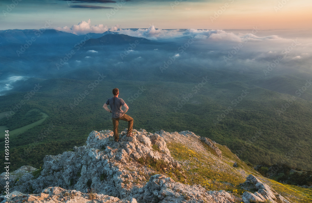 Man standing on a rocky mountain top