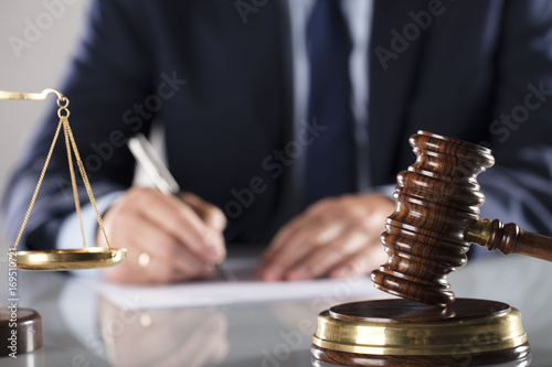 Lawyer concept. Law firm. Man signing agreement. Legal office.