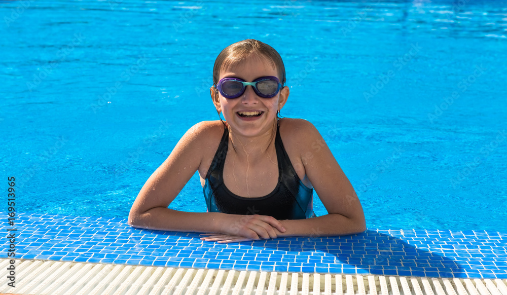Cute teen girl in swimming pool