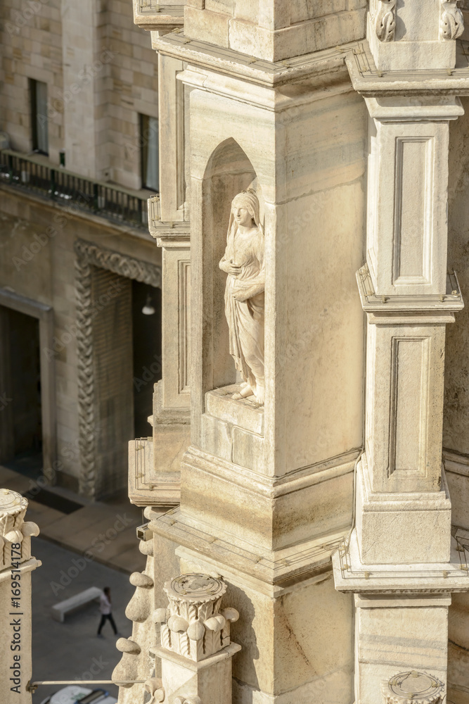 marble statue in niche on  Cathedral pinnacle, Milan, Italy