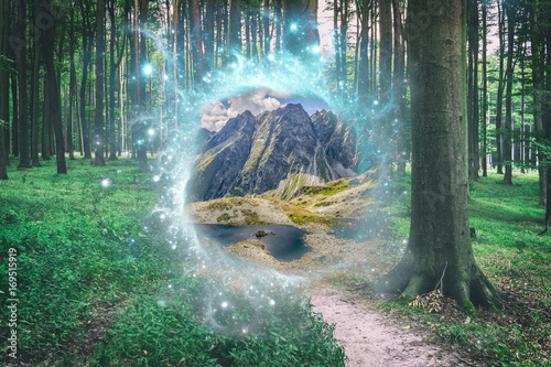 Magical portal between green forest and mountains photo