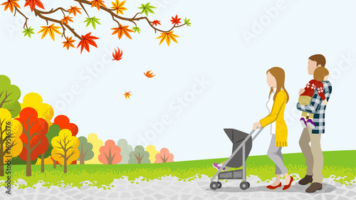 Walking family with Baby Stroller in autumn nature