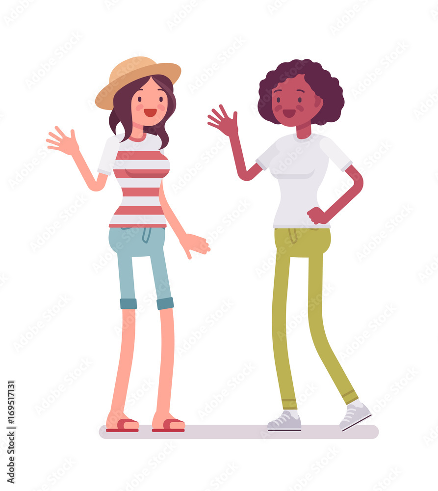 Young women greeting and waving