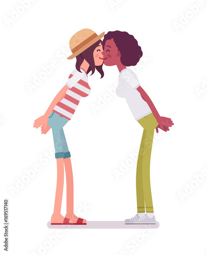 Young women exchanging kisses