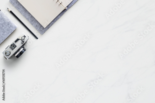 Business concept - Top view of modern office marble desktop background with blank notebook, pencil for mockup design and copy space