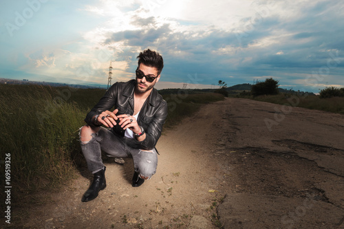 cool gouy smoking on a country road photo