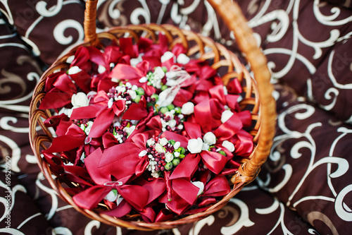 Red flower petals in the wicker basket.