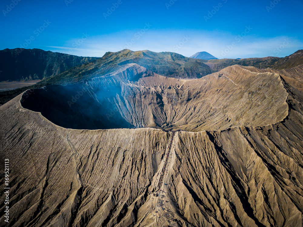 Mountain Bromo active volcano crater in East Jawa, Indonesia. Top view from drone fly - obrazy, fototapety, plakaty 