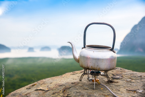 kettle on rock and background of mountains and sea view,Phang Nga Province, Thailand.