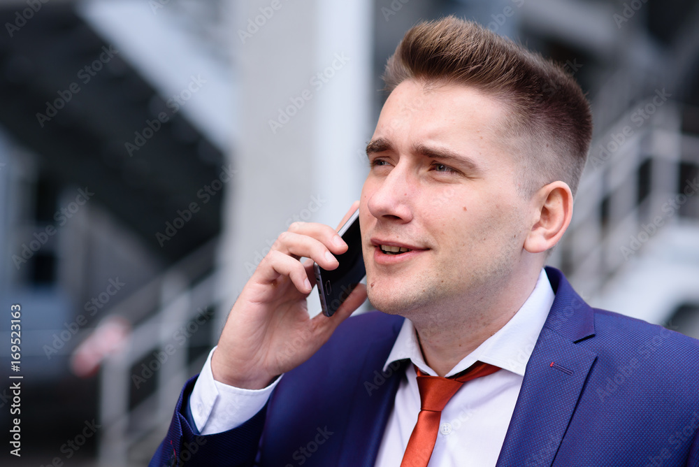 A successful business man talking on the phone. A successful business man talking on the phone.