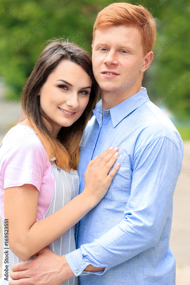 Lovely young couple in park on sunny day Lovely young couple in park on sunny day