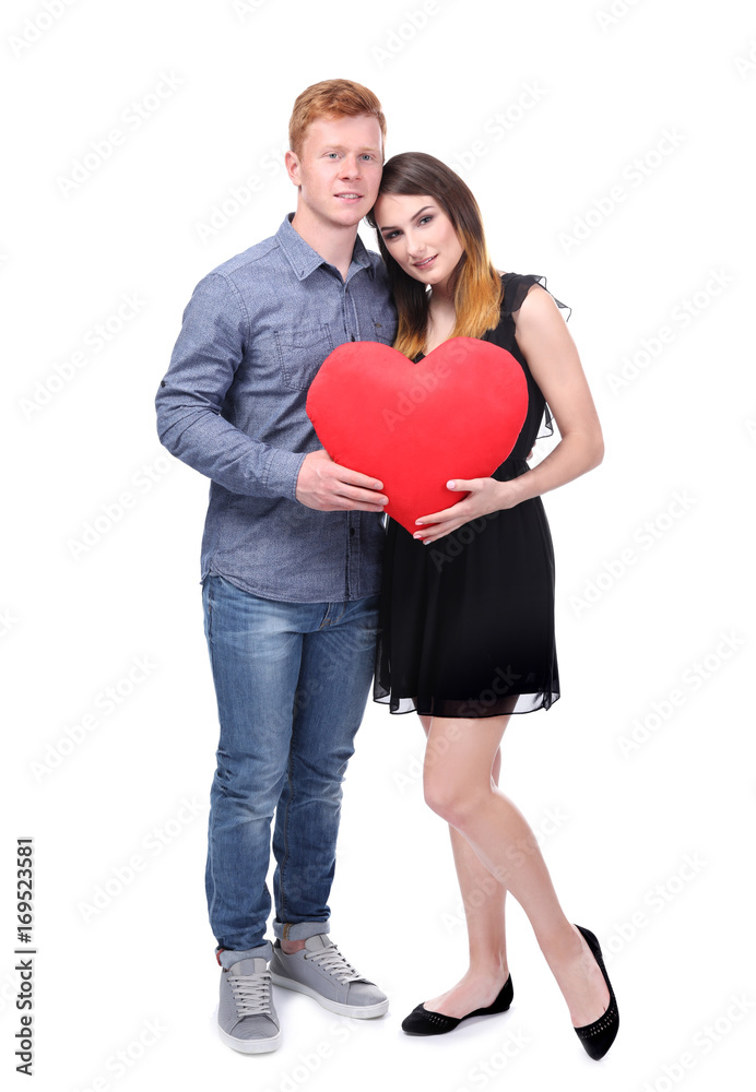 Lovely couple holding red heart on white background Lovely couple holding red heart on white background