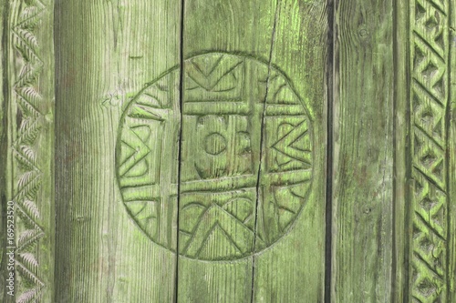 Background of green vintage carved wood circle ornament