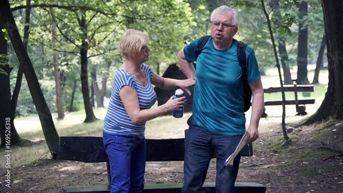 mature man having backbon pain during weekend trip 
 photo