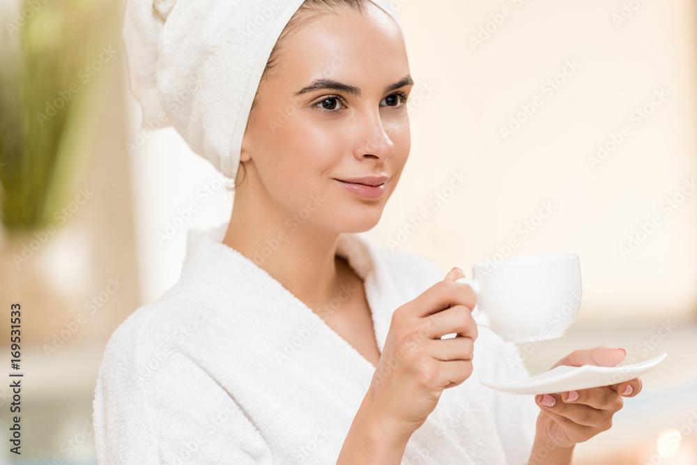 woman drinking tea after spa woman drinking tea after spa