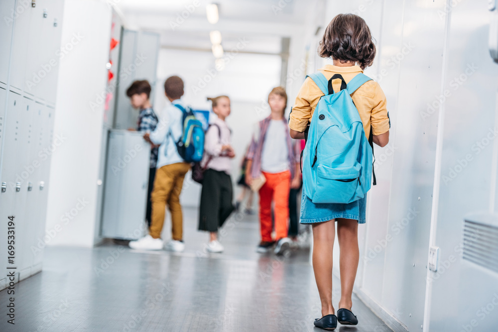 girl with backpack in school girl with backpack in school