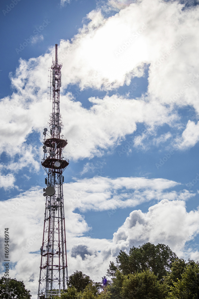 Between the blue cumulus column cold television tower Between the blue cumulus column cold television tower