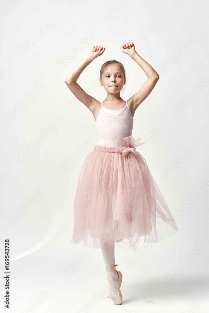 Little girl ballerina on a light background Little girl ballerina on a light background