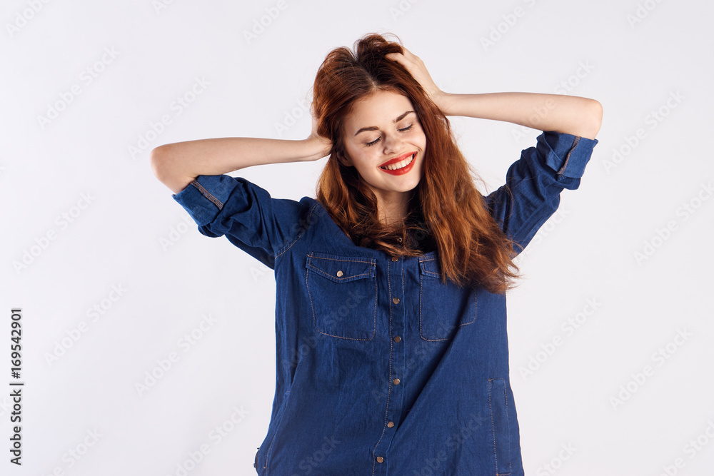 woman smiling and holding her head woman smiling and holding her head